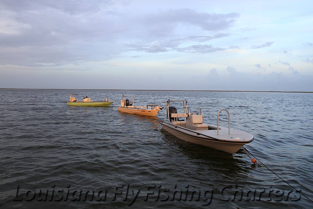 Green Moon with Louisiana Fly Fishing Charters pulls off a great shot while on a mother ship trip to the Chandeleur Islands, Louisiana. Greg had clients staying on the Southern Way of Southern Way Charters. Greg's boat is an East Cape Fury, Capt. Rocky Thickstun's Beavertail Elite, and Ben Tiller's Hell's Bay Whipray.