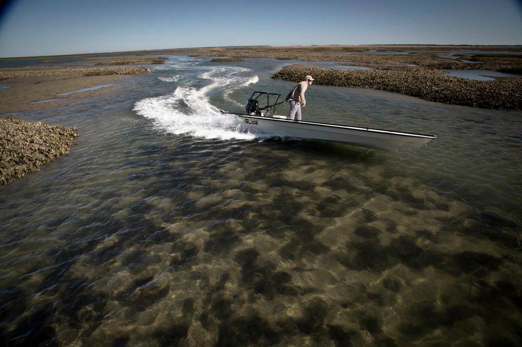 UNREAL shot with Graham Kenan running skinny in the new East Cape Canoes & Skiffs Glide...such a fantastic skiff: http://eastcapeskiffs.com/skiffs/glide/