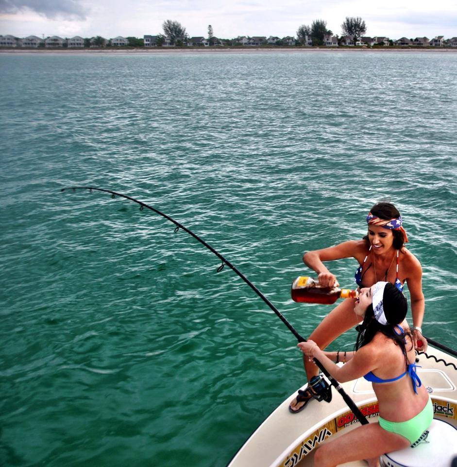 Fishing for MONSTER tarpon takes teamwork! Textbook teamwork in action right here with Capt. Krista Tucker providing sustenance of the Fireball kind to ElusiveTails very own Marcella while fighting her first Tarpon with CAPT. JEFF HAGAMAN! Fish 'em up, ladies! 