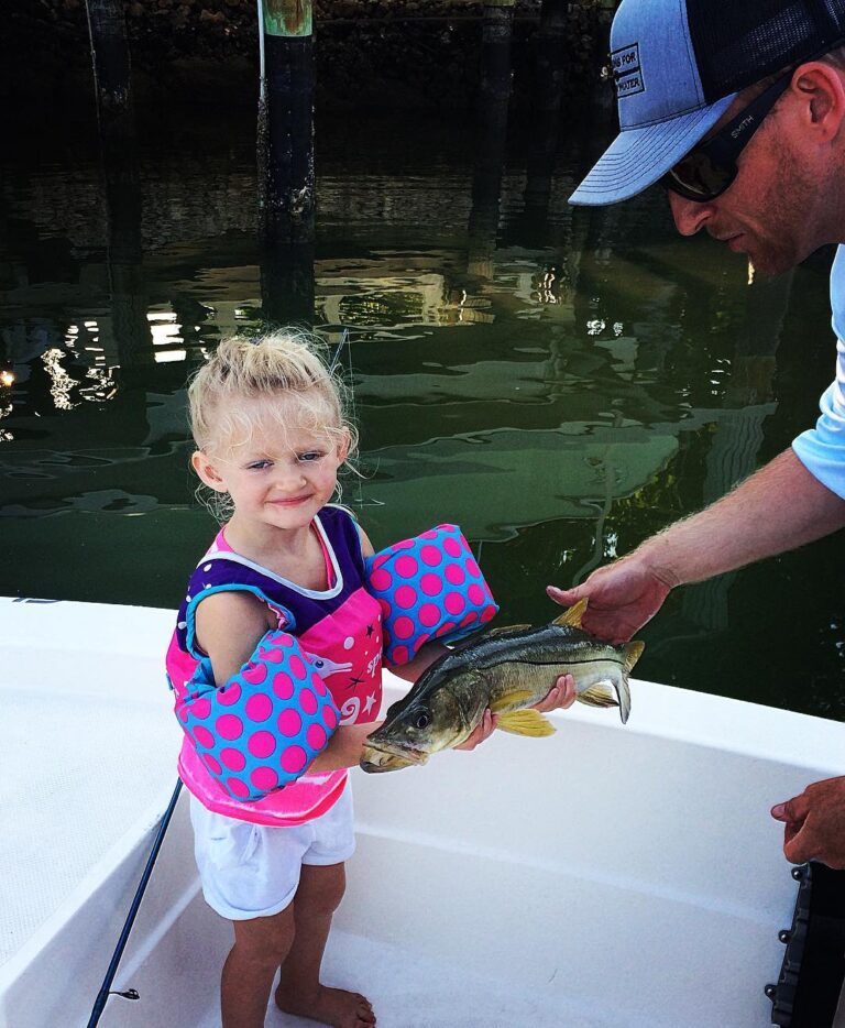 Learning proper fish handling young.