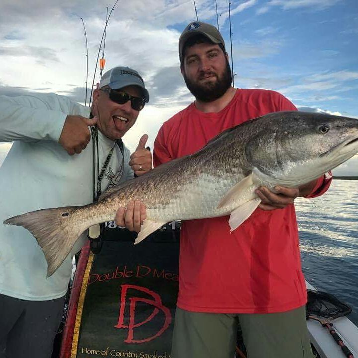 Drew with his first Redfish.. and a beast of a bull!