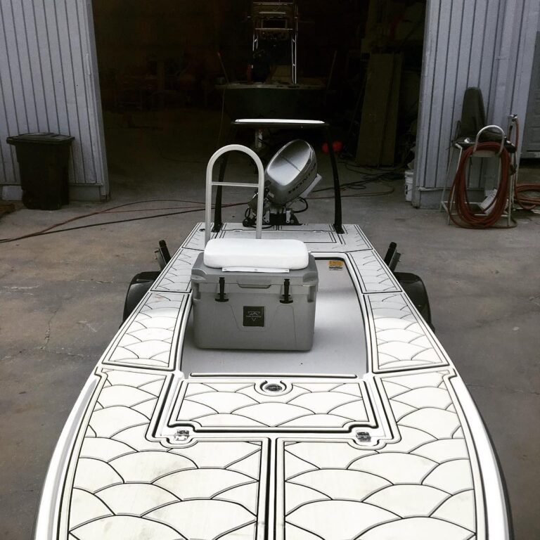 Mangrove bay skiff with custom grab rail and rod holders