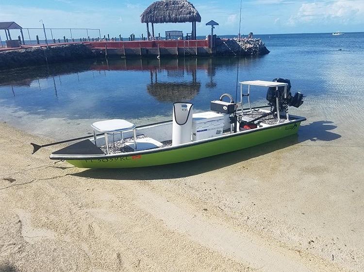 Billfish skiff up on the beach sitting pretty!