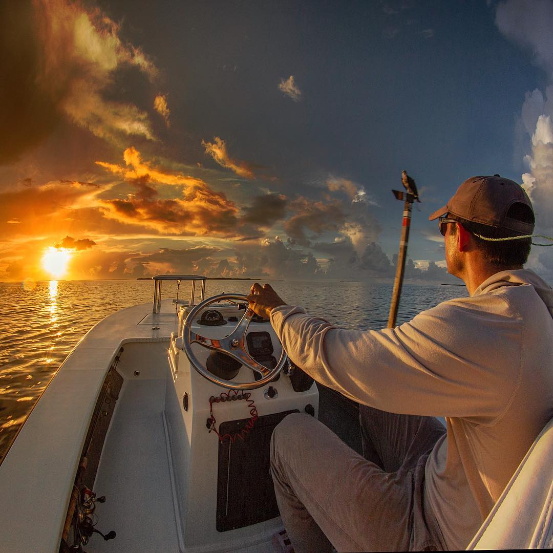 Two simple fishermen acknowledge each other and mindful of another beautiful dis