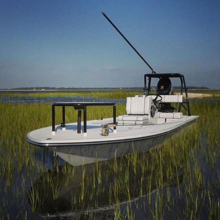 Beavertail Mosquito skiff floats in spit.