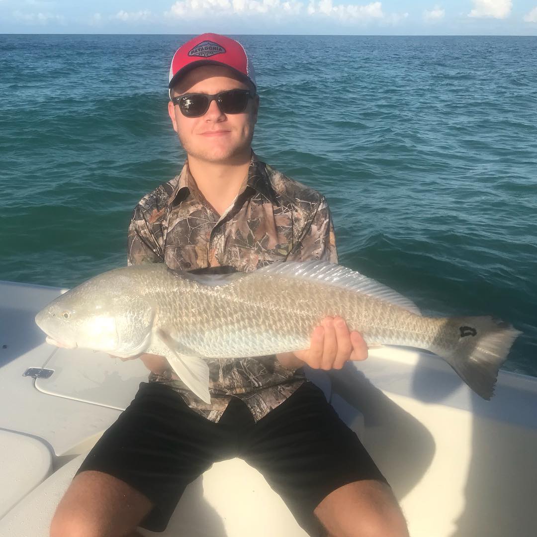 This is one lucky redfish! Take a look at the bite taken out of this