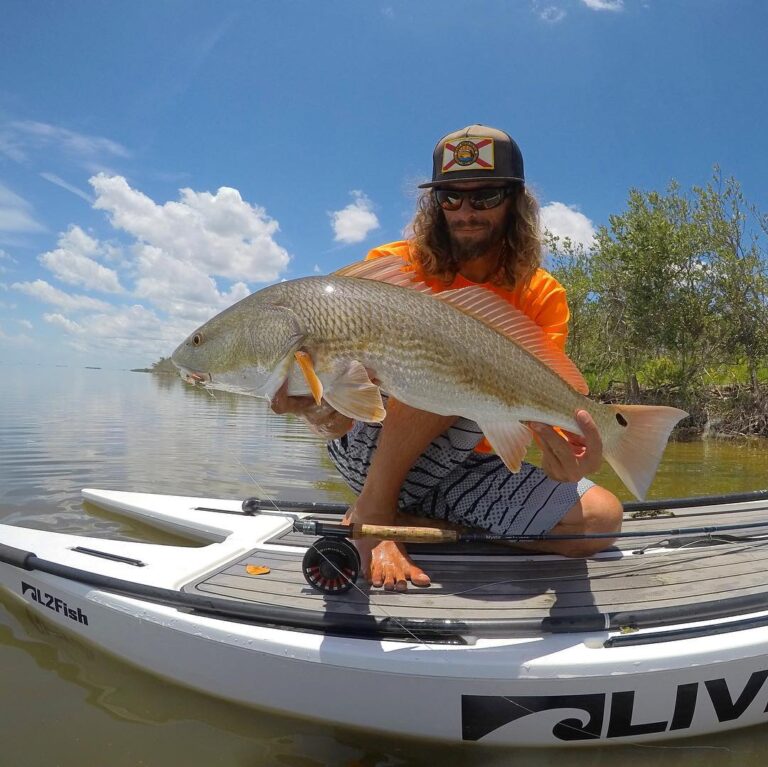 pro angler and 5 wt wizard  showing off a stud red and living up to his name on