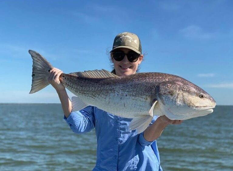 @coach_277 with his lady reeling in a massive redfish with our Redfish Hat, good…